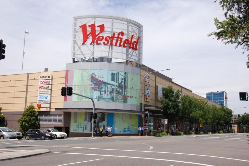 a building with a westfield sign on it on a street at Shine Apartment in Liverpool