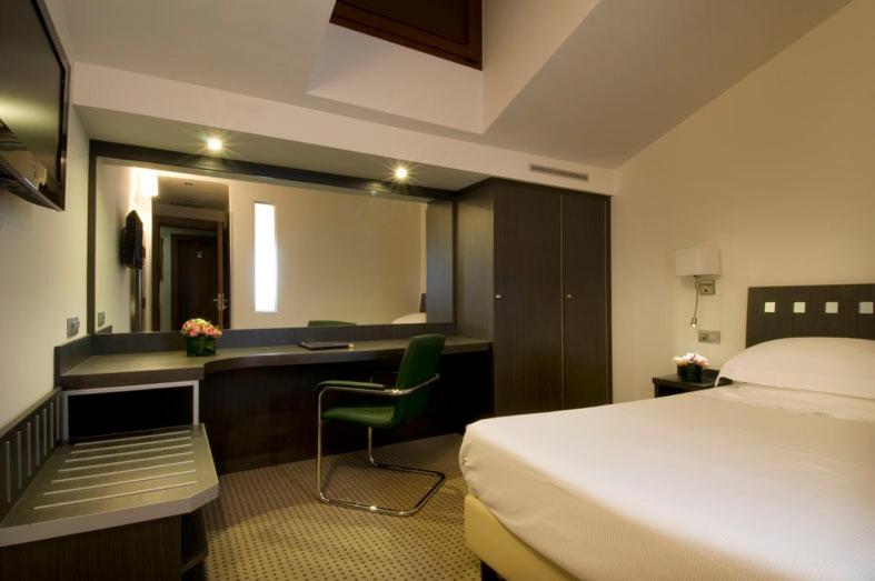 Postel nebo postele na pokoji v ubytování Arli Hotel Business and Wellness
