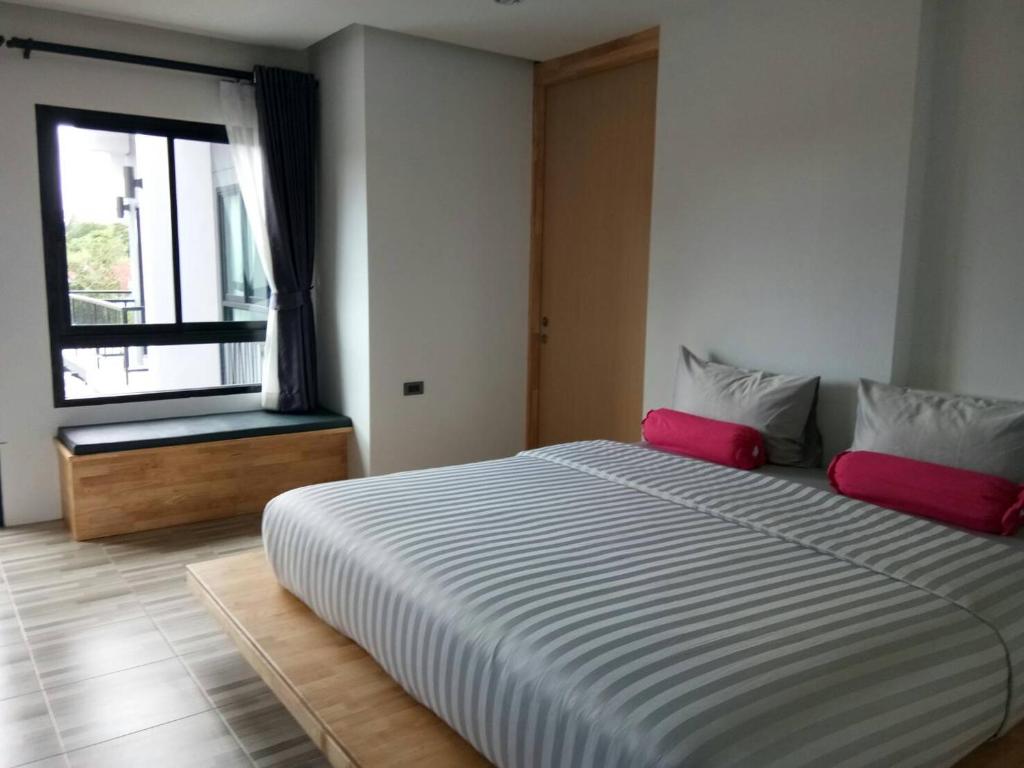 Postel nebo postele na pokoji v ubytování Sor Kor Sor Resort