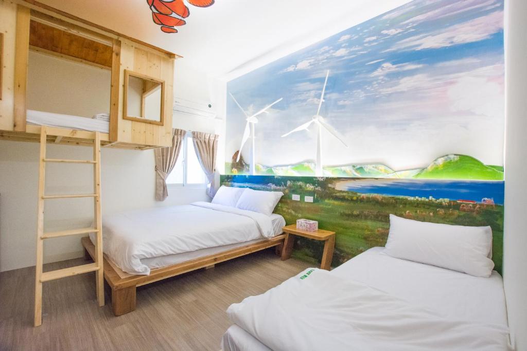 Postel nebo postele na pokoji v ubytování 解憂海灣Chill Bay潛水旅店