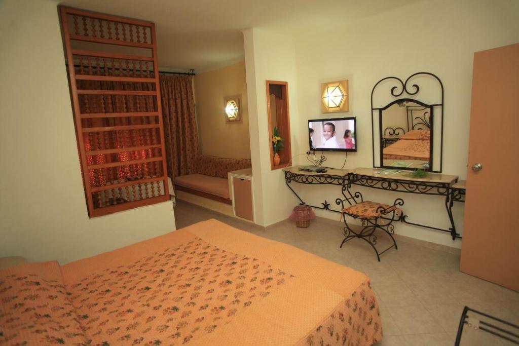 Postel nebo postele na pokoji v ubytování Hotel La Residence Hammamet