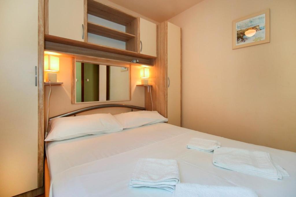 Posteľ alebo postele v izbe v ubytovaní tiho's apartments
