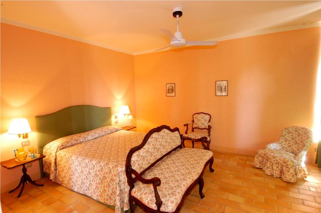 Łóżko lub łóżka w pokoju w obiekcie Agriturismo Il Torrione
