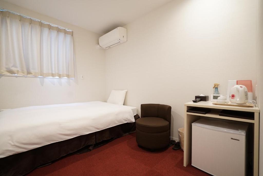 Postel nebo postele na pokoji v ubytování CVS Bay Hotel New Building