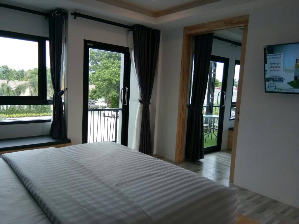 Postel nebo postele na pokoji v ubytování Sor Kor Sor Resort