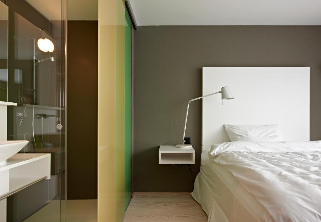 Postel nebo postele na pokoji v ubytování Hotel Restaurant Rössli