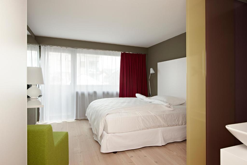 Postel nebo postele na pokoji v ubytování Hotel Restaurant Rössli