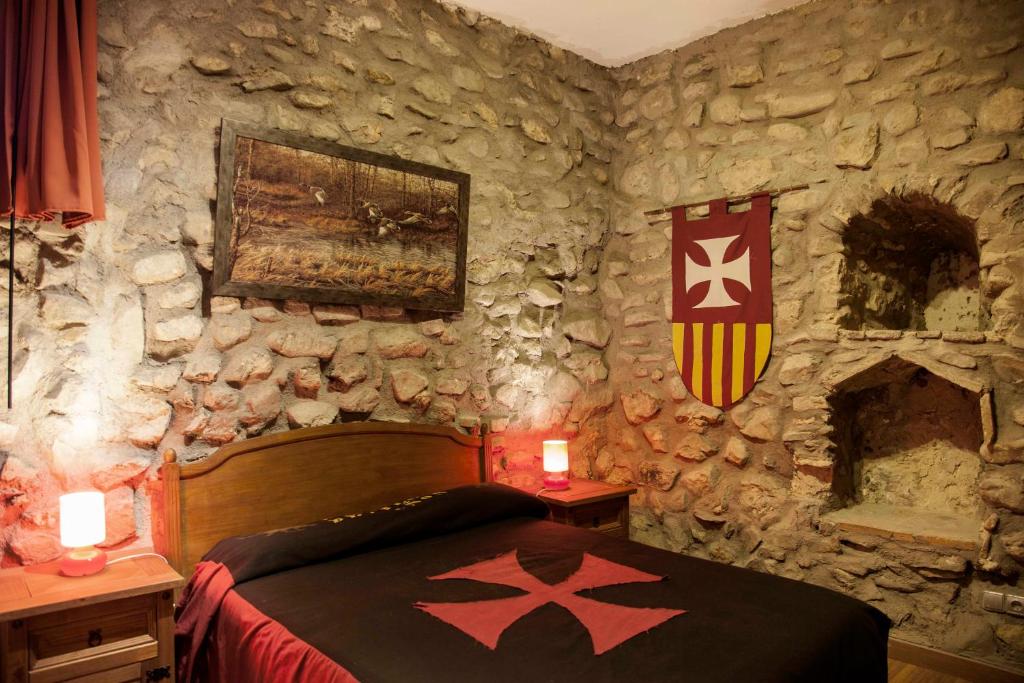 Postel nebo postele na pokoji v ubytování Castillo de Añón de Moncayo
