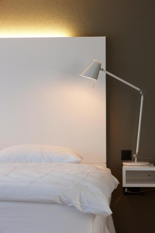 Postel nebo postele na pokoji v ubytování Hotel Restaurant Rössli