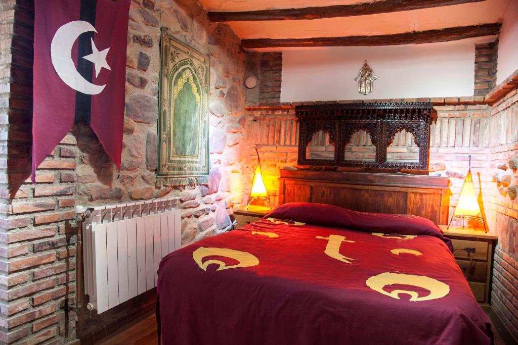 Postel nebo postele na pokoji v ubytování Castillo de Añón de Moncayo