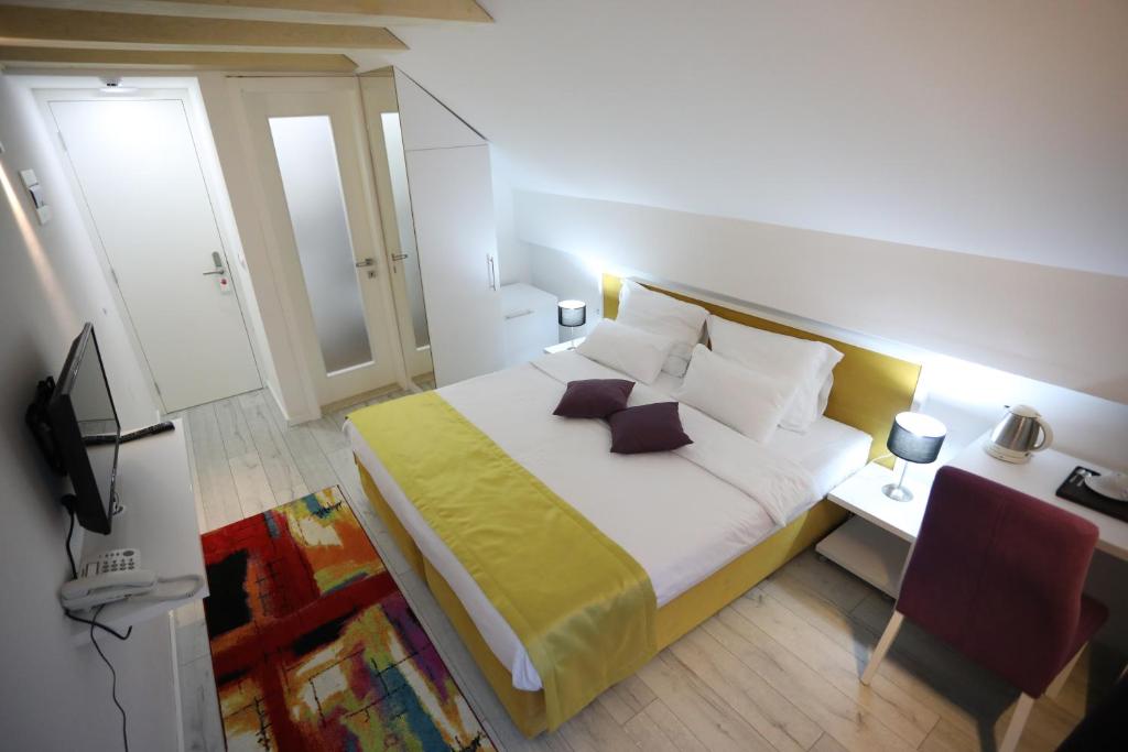 Postel nebo postele na pokoji v ubytování Hotel Boutique Libris