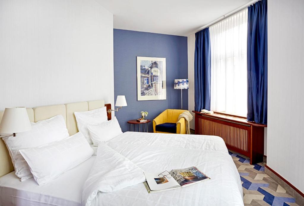 Postel nebo postele na pokoji v ubytování Seaside Park Hotel Leipzig
