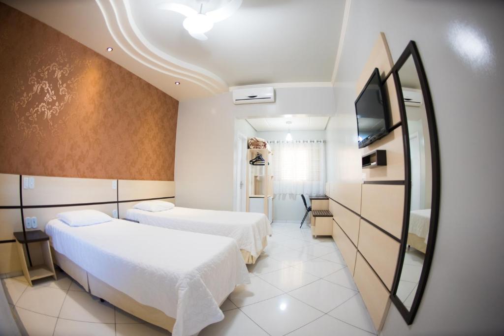 Postel nebo postele na pokoji v ubytování Hotel Tito's