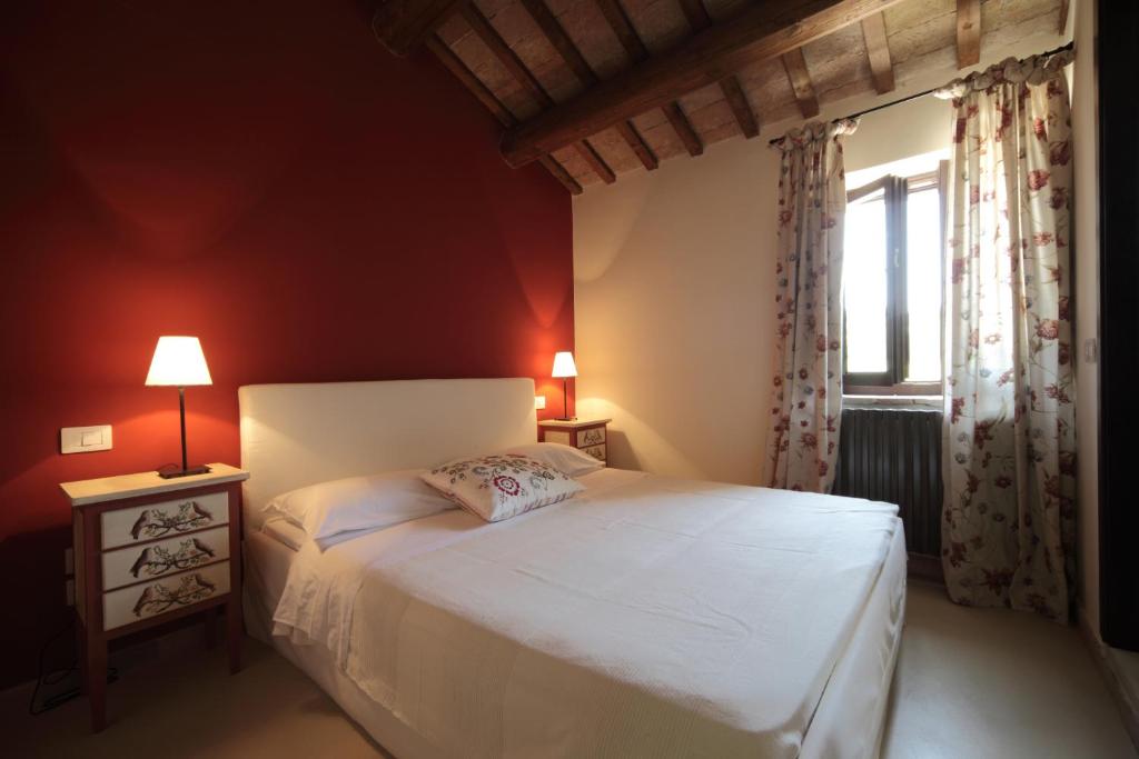 Postel nebo postele na pokoji v ubytování Agriturismo Segnavento