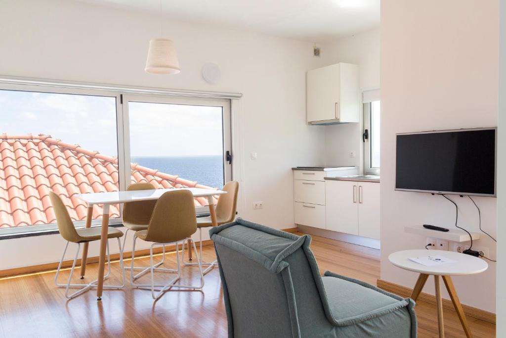 TV a/nebo společenská místnost v ubytování Lofts Azul Pastel