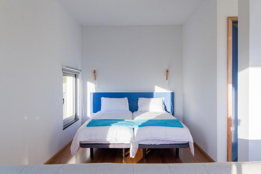 Postel nebo postele na pokoji v ubytování Lofts Azul Pastel