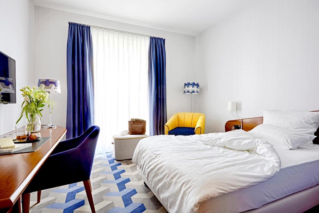 Postel nebo postele na pokoji v ubytování Seaside Park Hotel Leipzig
