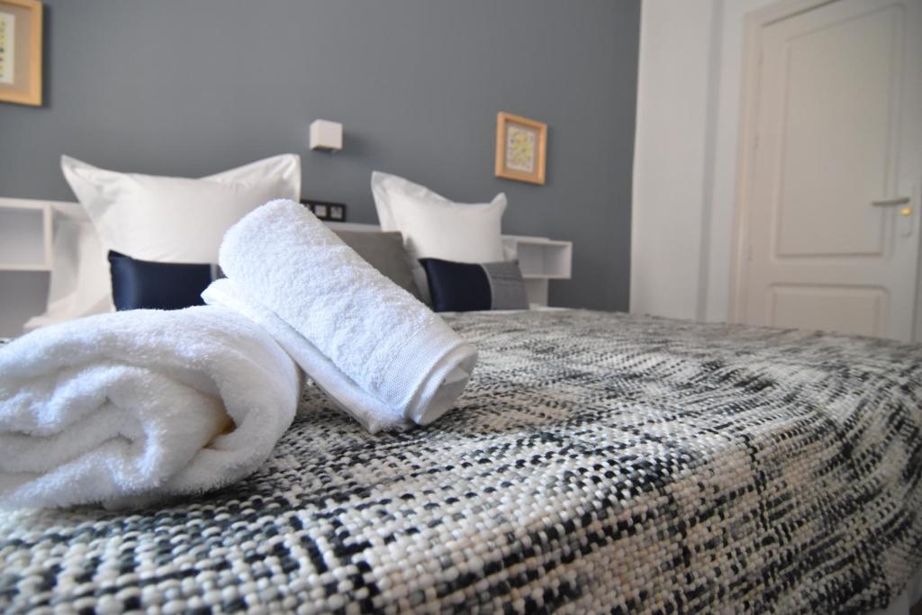 Posteľ alebo postele v izbe v ubytovaní Apartamento Recogidas 39