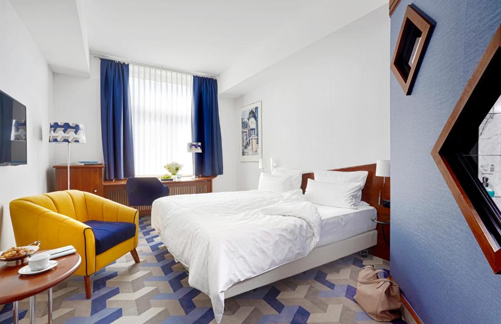 Postel nebo postele na pokoji v ubytování Seaside Park Hotel Leipzig