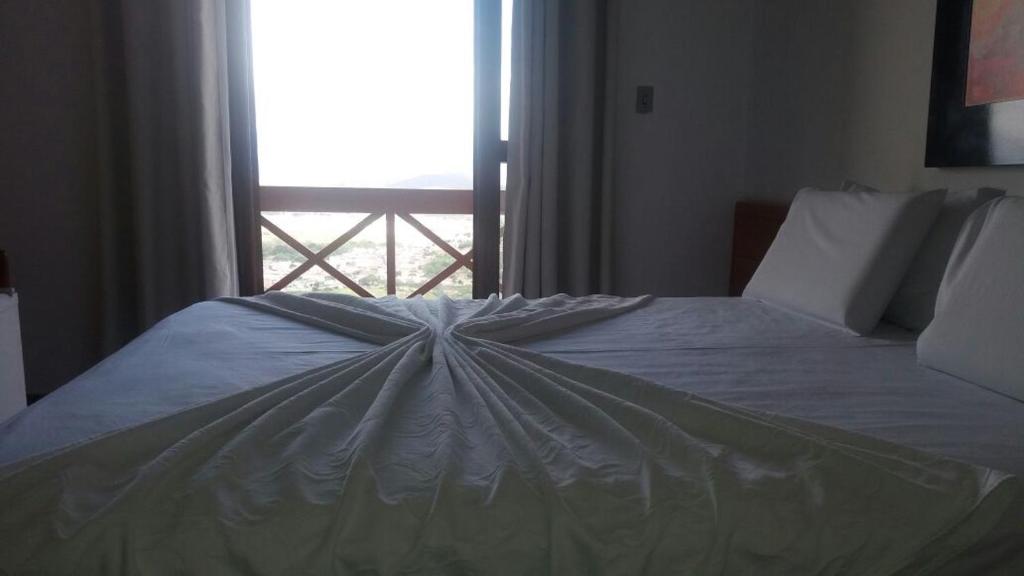 Postel nebo postele na pokoji v ubytování Hotel Serra do Ouro