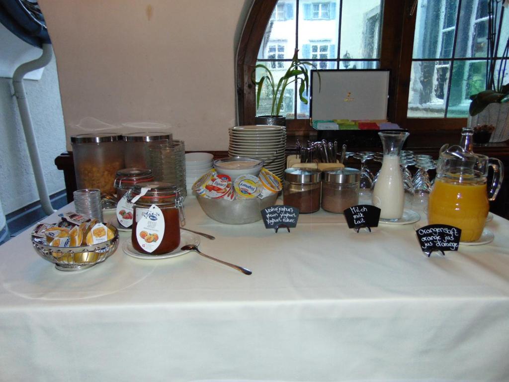 a table with food and drinks on top of it at Zunfthaus zur Rebleuten in Chur