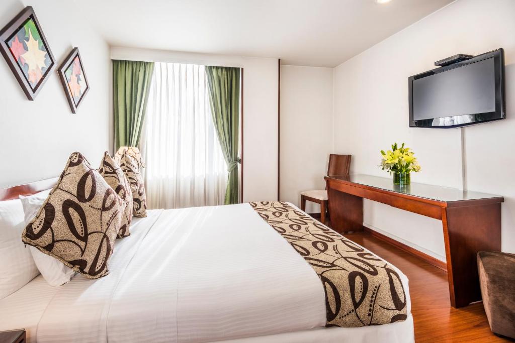 Postel nebo postele na pokoji v ubytování Hotel Platinum Suite
