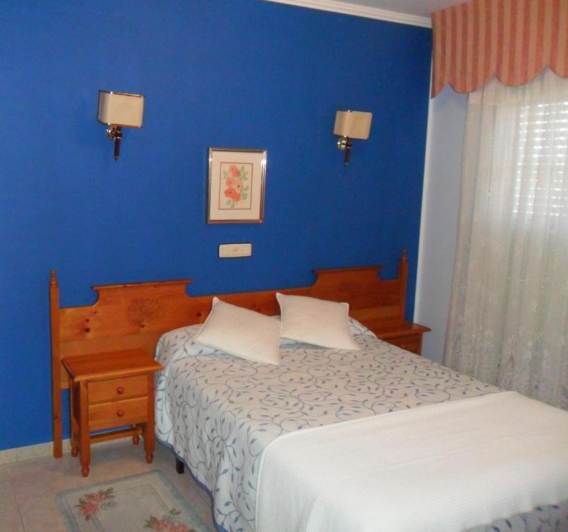 Postel nebo postele na pokoji v ubytování Hotel Vimar