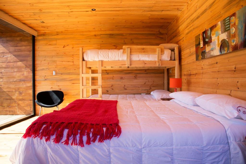 Postel nebo postele na pokoji v ubytování Lodge KARKÚ