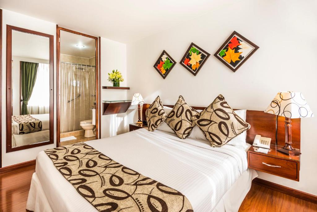 Postel nebo postele na pokoji v ubytování Hotel Platinum Suite