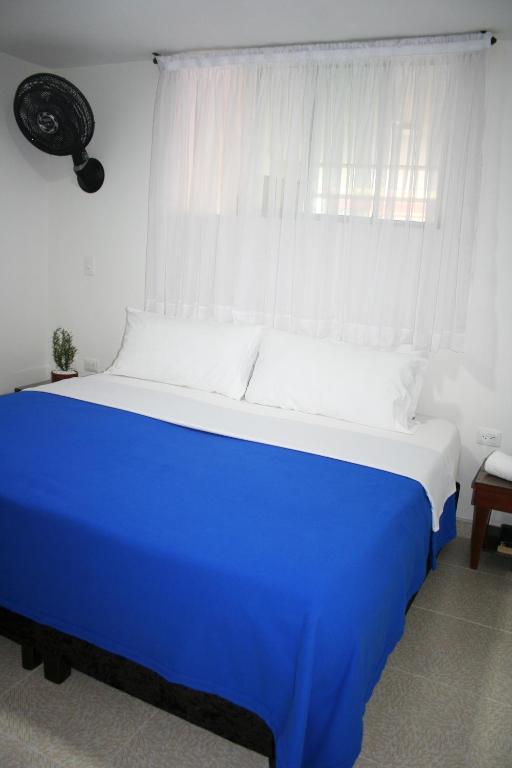 Postel nebo postele na pokoji v ubytování Hotel Getsemaní BGA