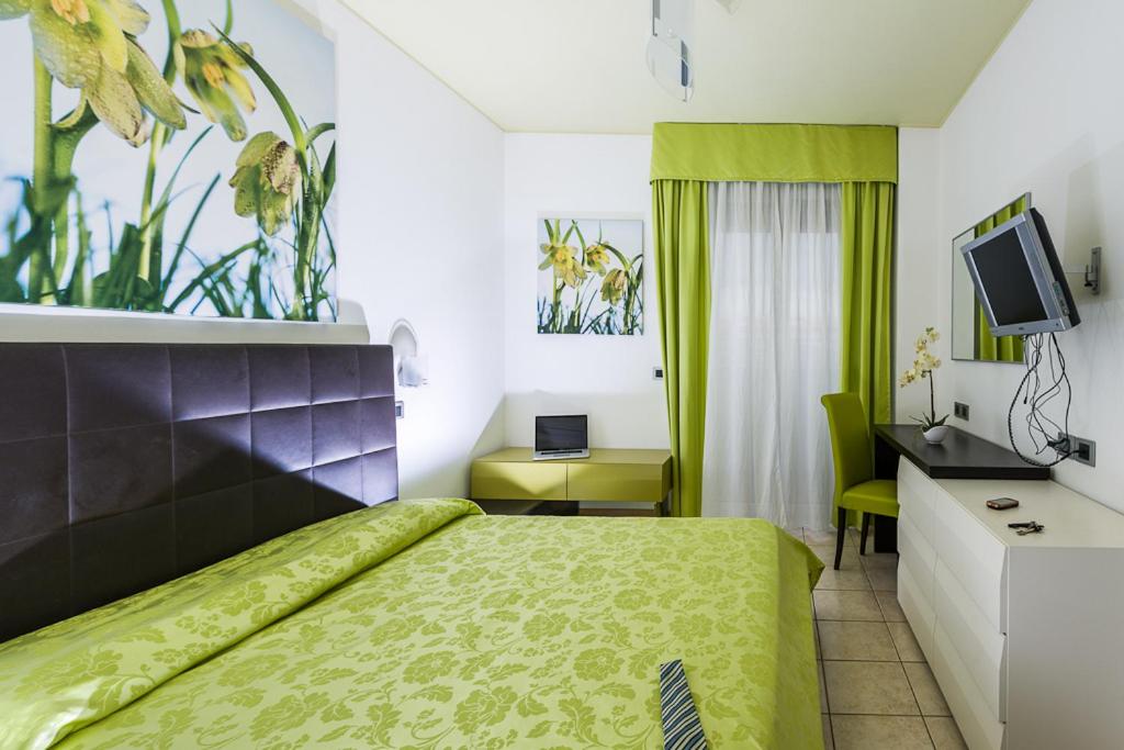 TV a/nebo společenská místnost v ubytování Hotel Alle Due Palme