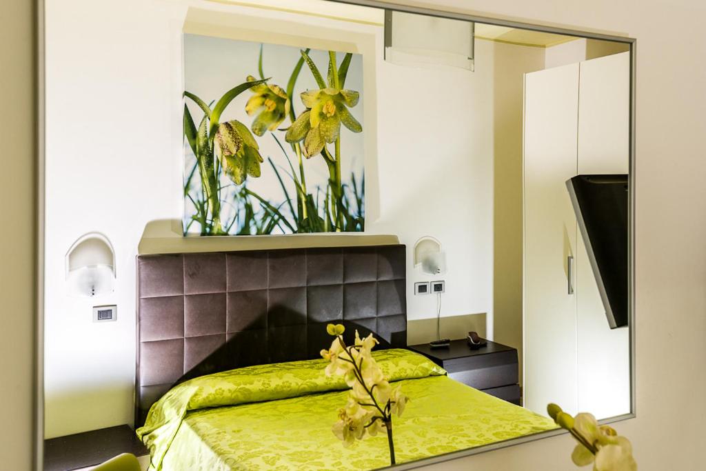 Postel nebo postele na pokoji v ubytování Hotel Alle Due Palme