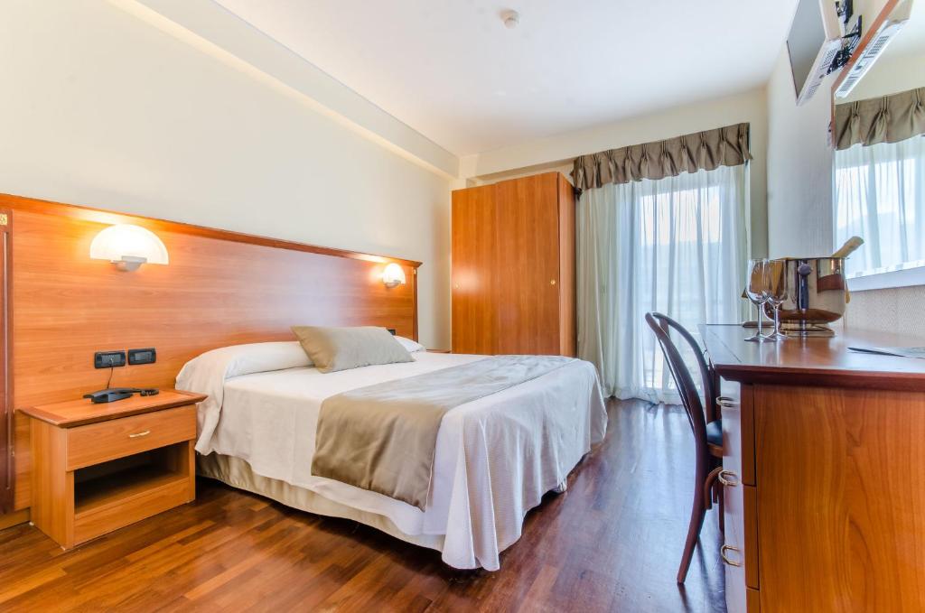 Postel nebo postele na pokoji v ubytování Hotel Federico II