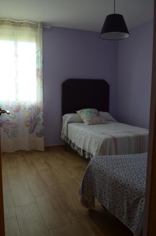 Postel nebo postele na pokoji v ubytování Apartamento Plaza Castañuelas