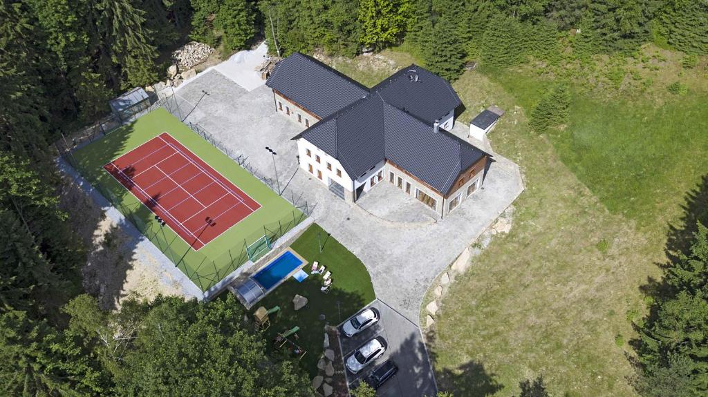 an aerial view of a house with a solar panel at Club Rezidence Pod Lučí in Loučovice