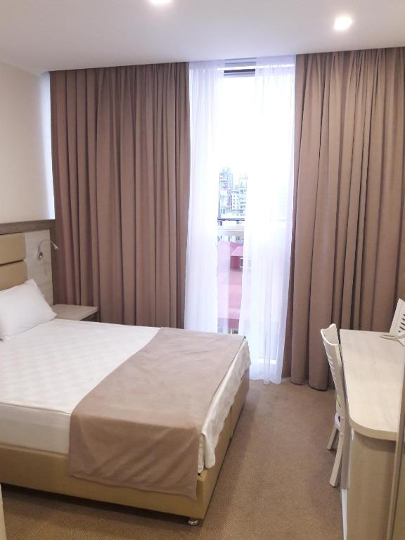 Postel nebo postele na pokoji v ubytování Hotel Green Glass