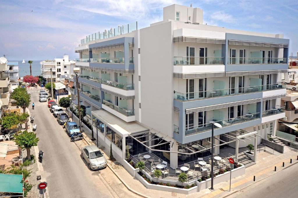 an architectural rendering of a white building on a street at Astron Suites & Apartments in Kos