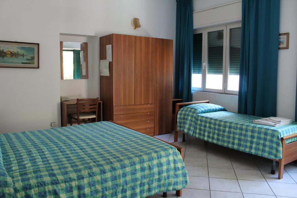 Postel nebo postele na pokoji v ubytování Hotel Edera