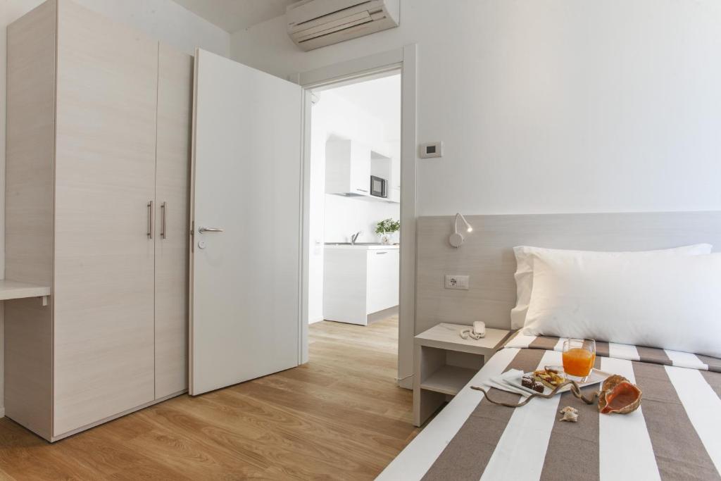 Postel nebo postele na pokoji v ubytování Hotel Houston Suites