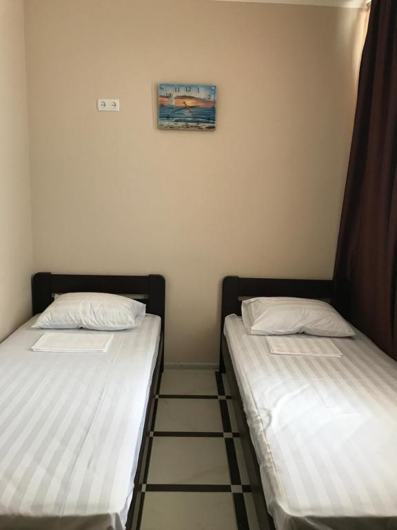 Postel nebo postele na pokoji v ubytování Asteria
