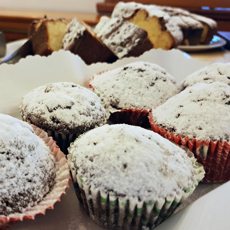 a bunch of muffins with powdered sugar on them at Residence Villaggio Verde in Sorrento