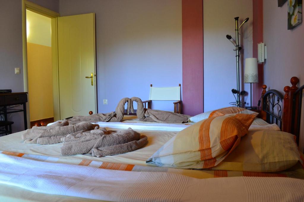 Postel nebo postele na pokoji v ubytování Scorpios Apartments