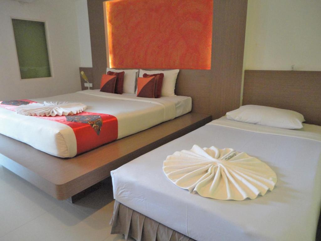 Cama ou camas em um quarto em La Moon At Phuket - SHA Extra Plus