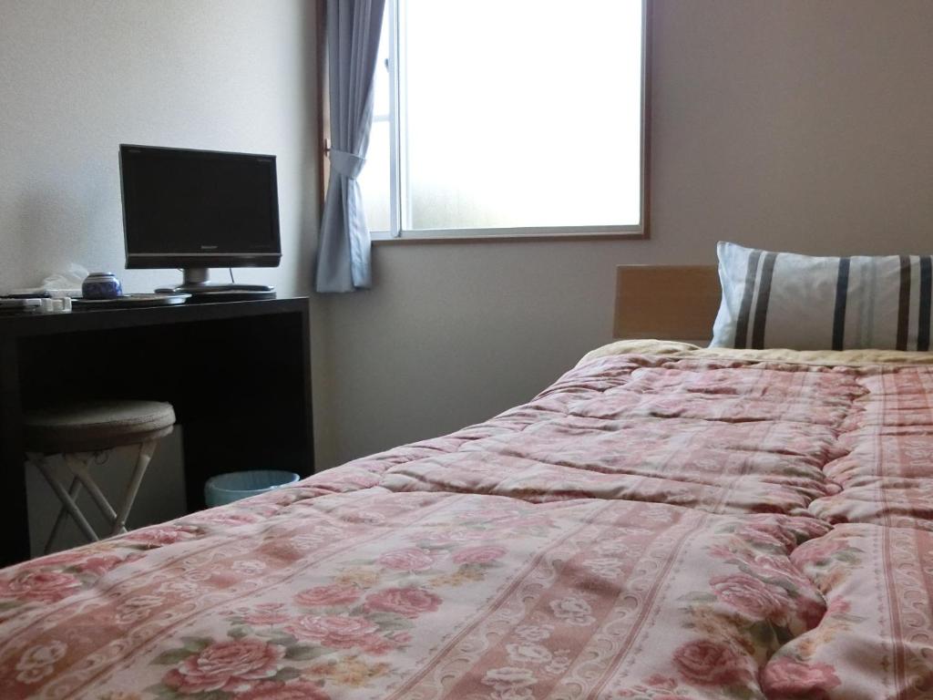 Postel nebo postele na pokoji v ubytování Suzukisou