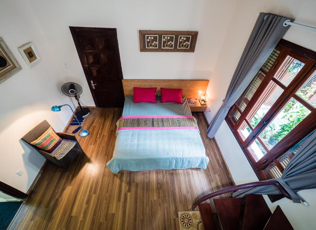 Postel nebo postele na pokoji v ubytování Hanoi Balcony Homestay