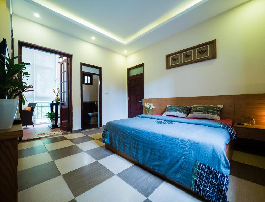 Postel nebo postele na pokoji v ubytování Hanoi Balcony Homestay