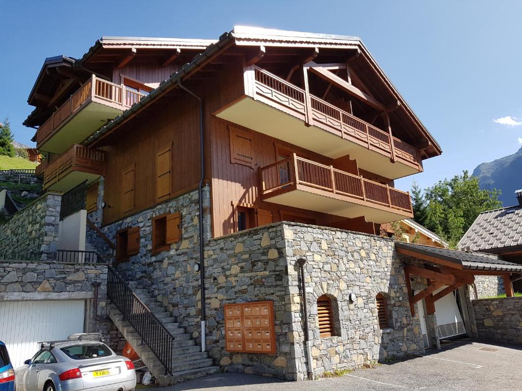 a house with two balconies on top of it at Arpege Des Neiges in Sainte-Foy-Tarentaise