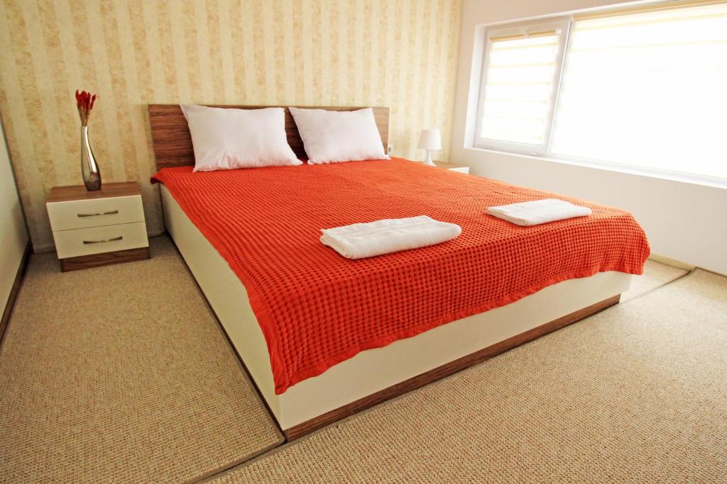 Postel nebo postele na pokoji v ubytování Lilly Apartments