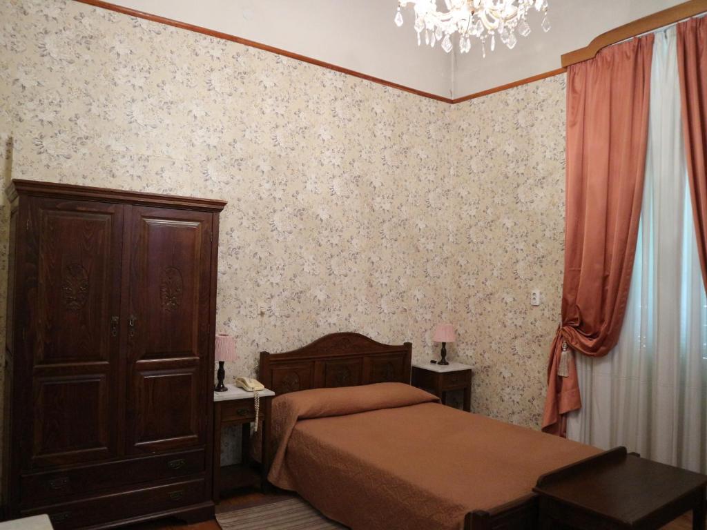 Postel nebo postele na pokoji v ubytování Acropolis House