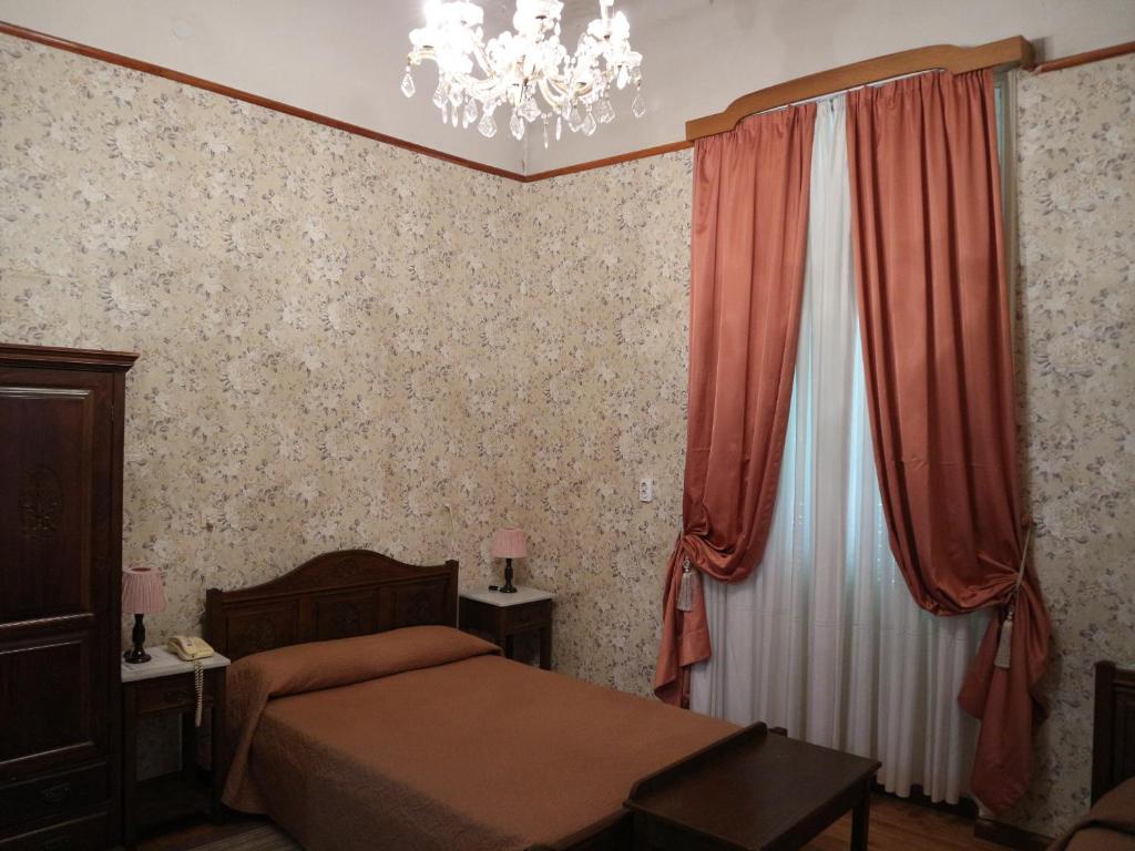 Postel nebo postele na pokoji v ubytování Acropolis House